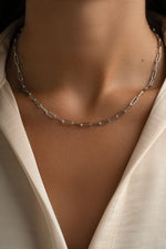 Sterling silver Paperclip Necklace from Sami Jewels featuring sleek, modern design on a model.