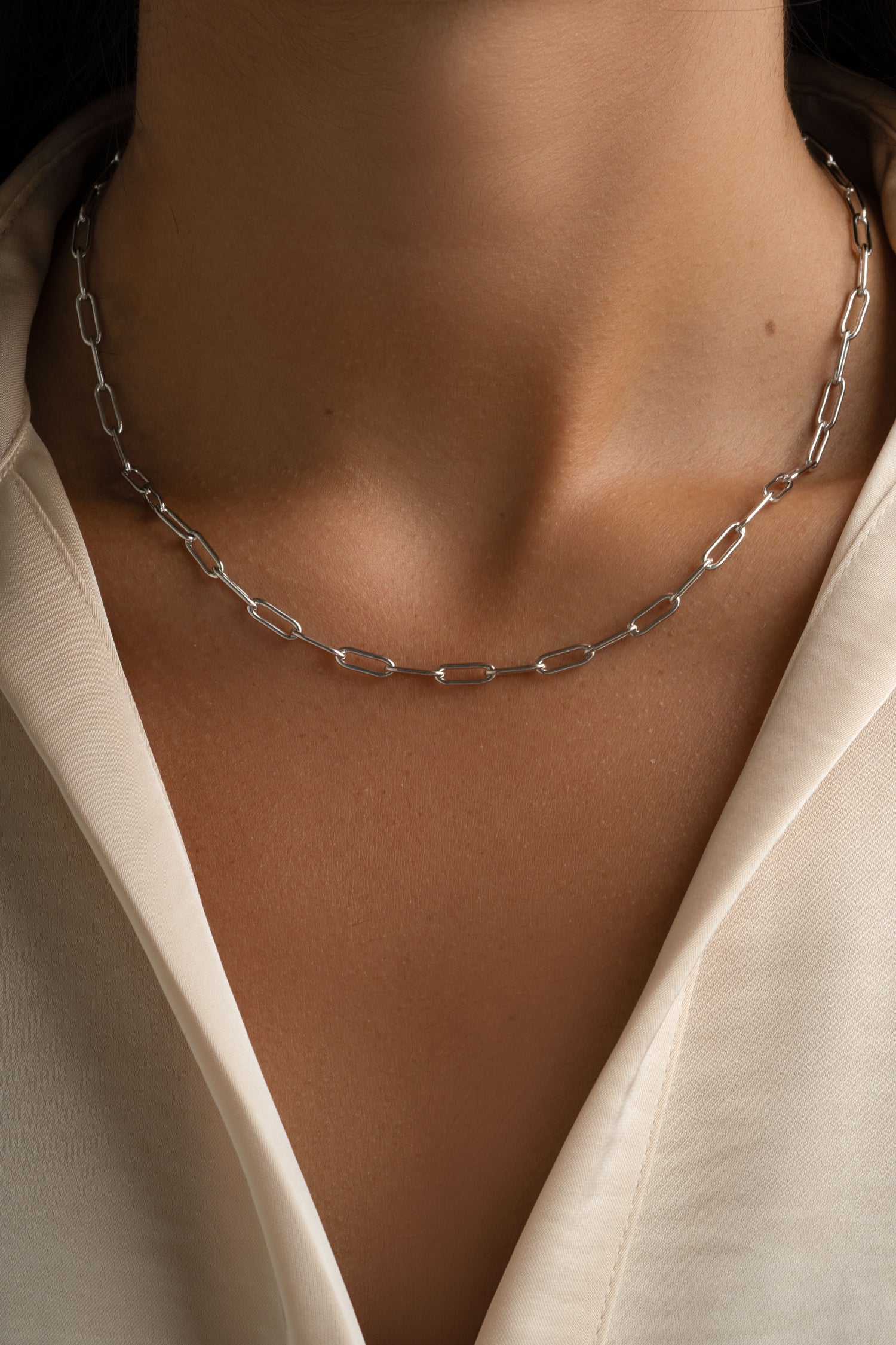 Sterling silver Paperclip Necklace from Sami Jewels featuring sleek, modern design on a model.