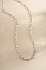 Sterling silver Paperclip Necklace by Sami Jewels featuring elongated chain links on a sleek, modern jewelry piece.