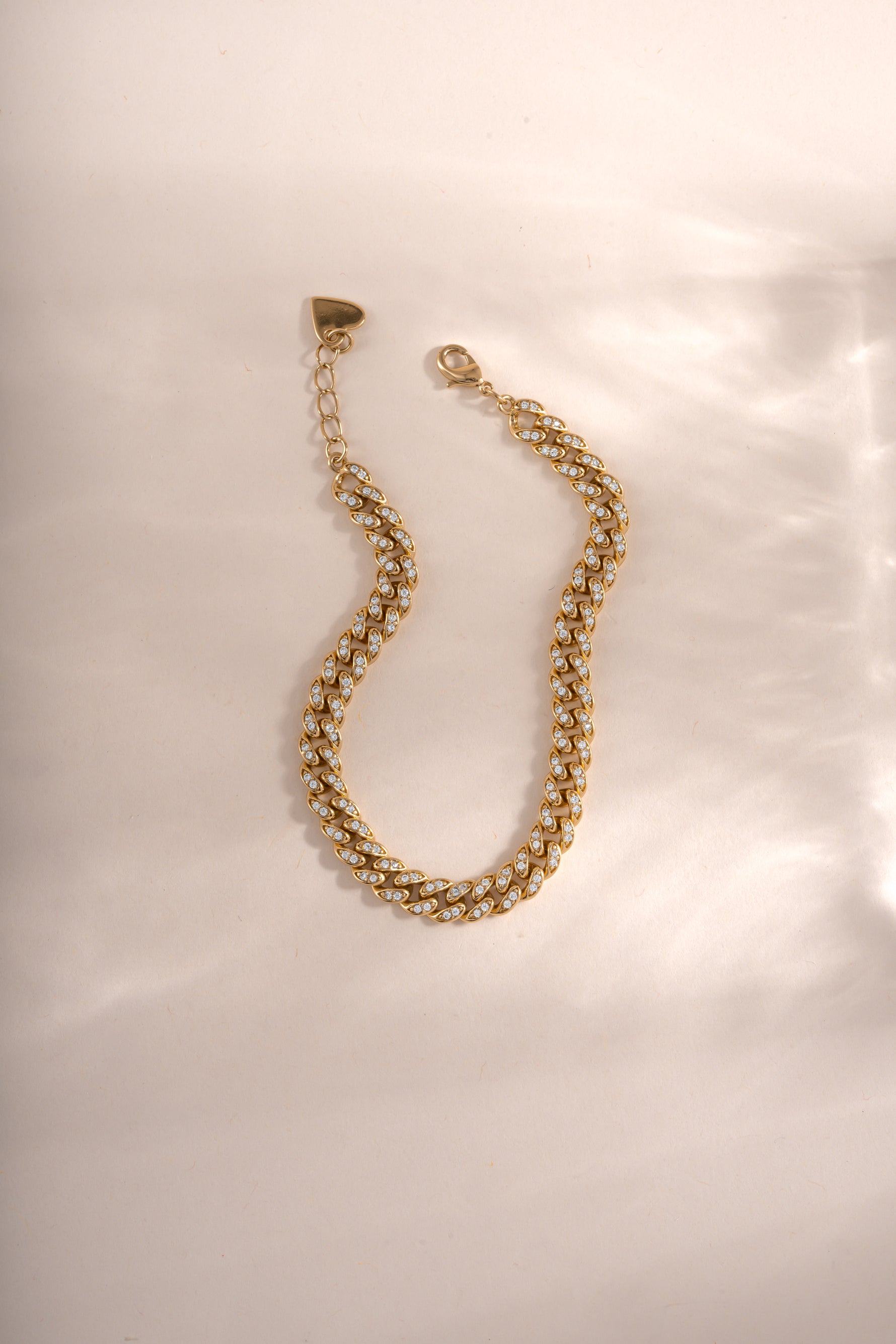 Gold Pavé Chain Link Bracelet by Sami Jewels with a lobster clasp closure, showcasing intricate pave detailing and linked chain design.