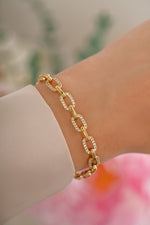 Gold pave chain link bracelet by Sami Jewels featuring sparkling pave details and a sleek, modern design.