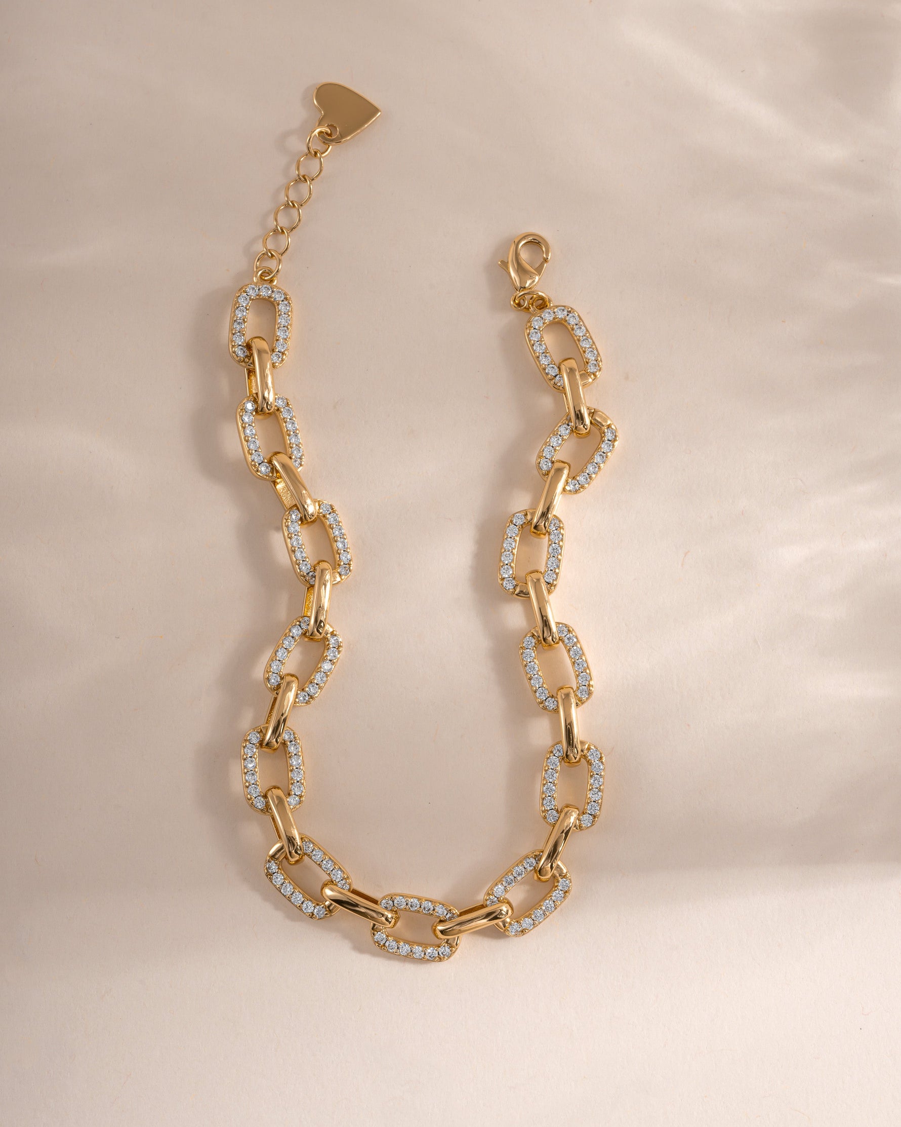 Gold pave chain link bracelet by Sami Jewels featuring a sleek, sparkling design with intricate links.