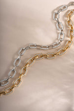 Silver and gold pave chain link bracelet by Sami Jewels featuring intricate pave detailing and a secure clasp.