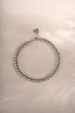 Close-up of a silver Pavé Chain Link Bracelet by Sami Jewels, showing intricate chain links and sparkling pave design.