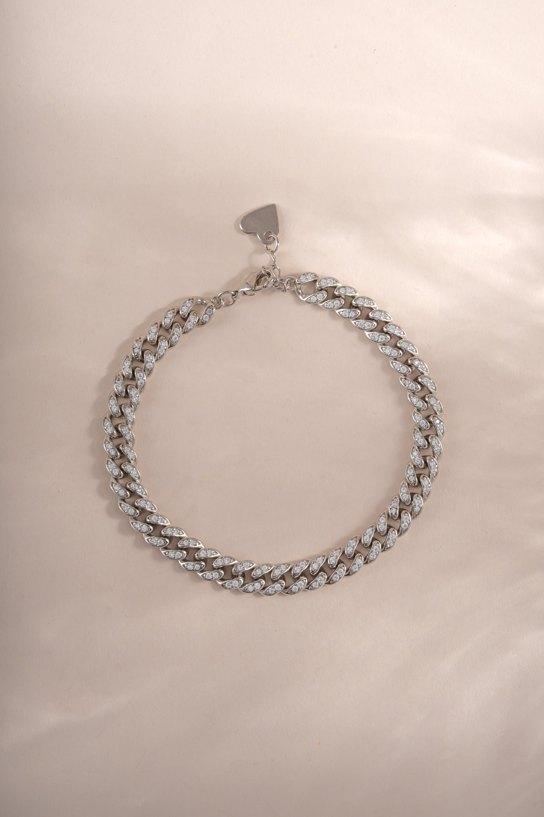 Close-up of a silver Pavé Chain Link Bracelet by Sami Jewels, showing intricate chain links and sparkling pave design.
