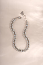 Silver Pavé Chain Link Bracelet by Sami Jewels laid flat, showcasing its intricate pave design and chain link details.