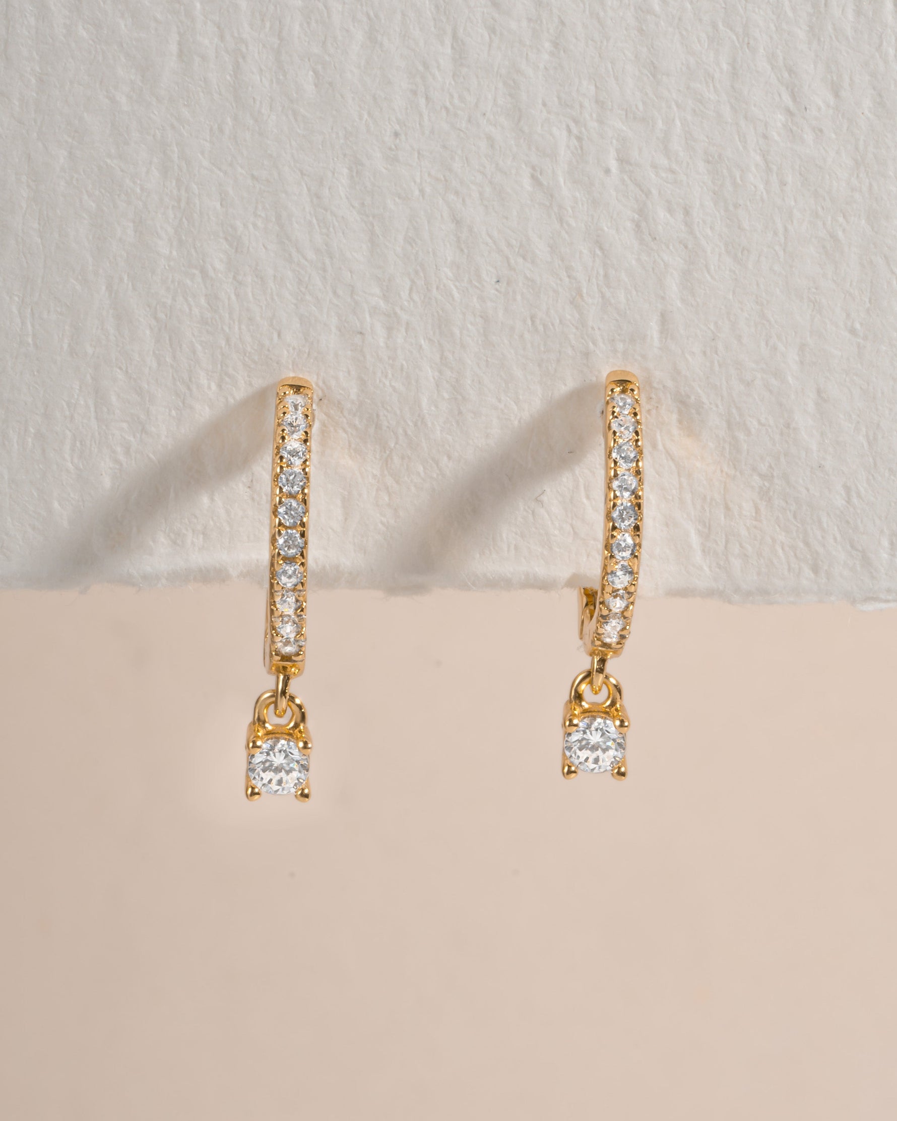 Gold Pavé Charm Huggies earrings by Sami Jewels featuring sparkling pave detailing and a secure hoop design.