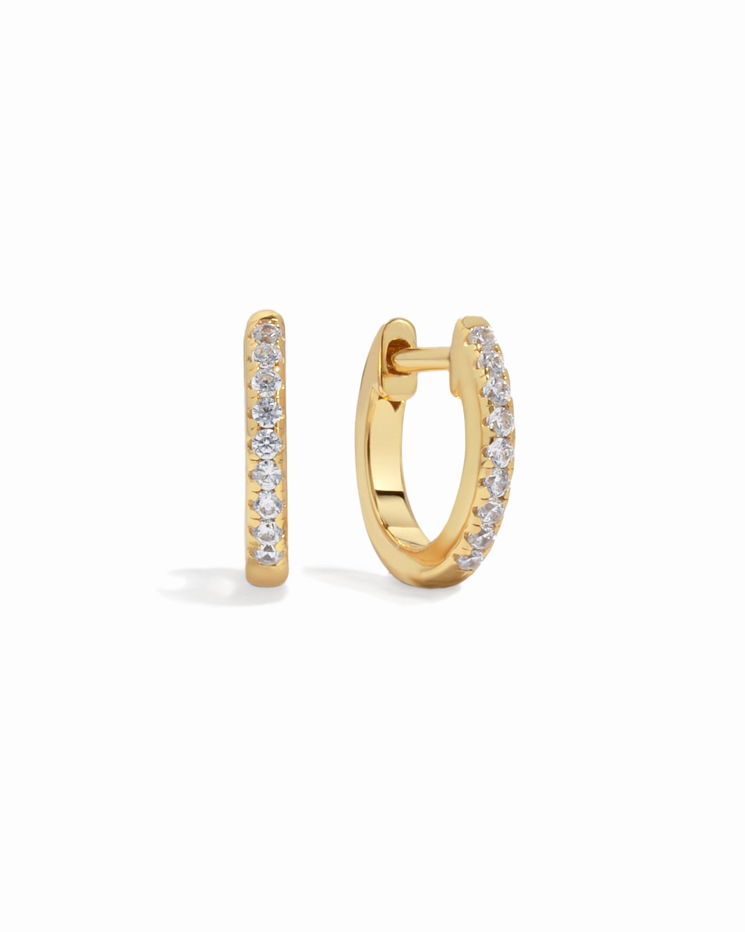 Gold 8mm pavé diamond huggie earrings by Sami Jewels, featuring sparkling pave design on a white background.