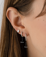 Sterling silver 8mm and 11mm pavé diamond huggie earrings by Sami Jewels featuring sparkling pave-set stones.