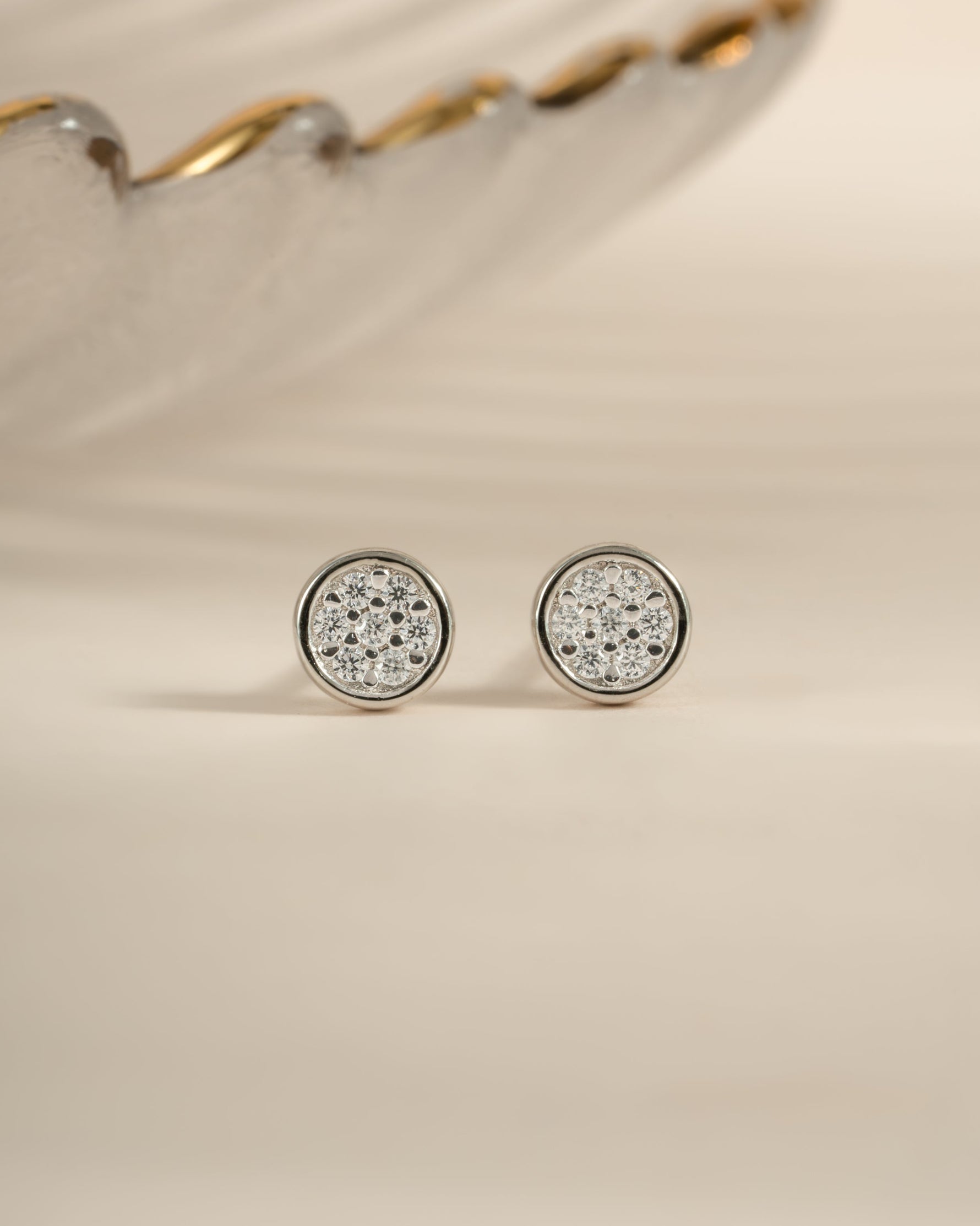 Sterling silver Pavé Disc Stud Earrings by Sami Jewels, front view showing sparkling pave design on round studs.