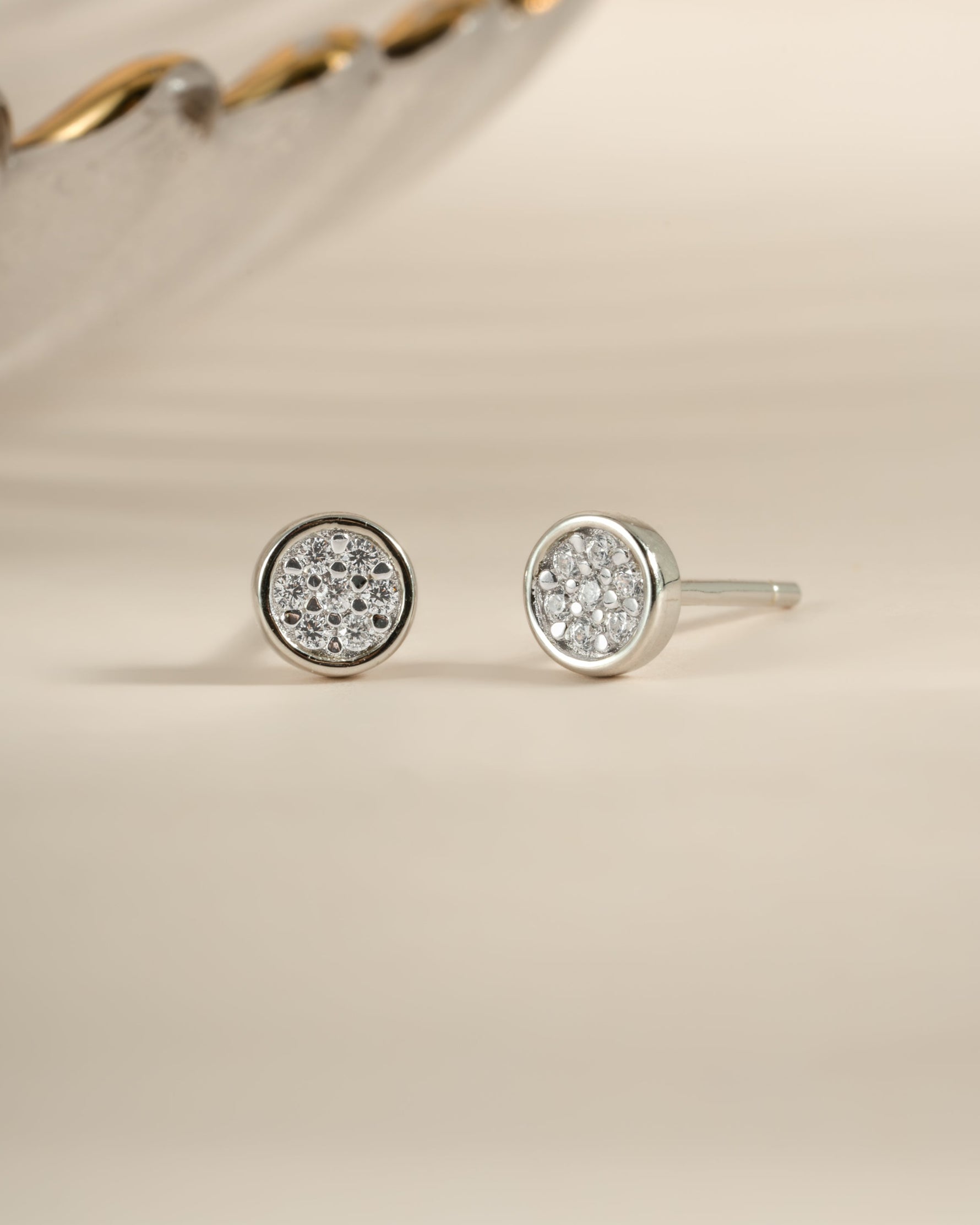 Sterling silver Pavé Disc Stud Earrings by Sami Jewels featuring sparkling pave design on small round studs