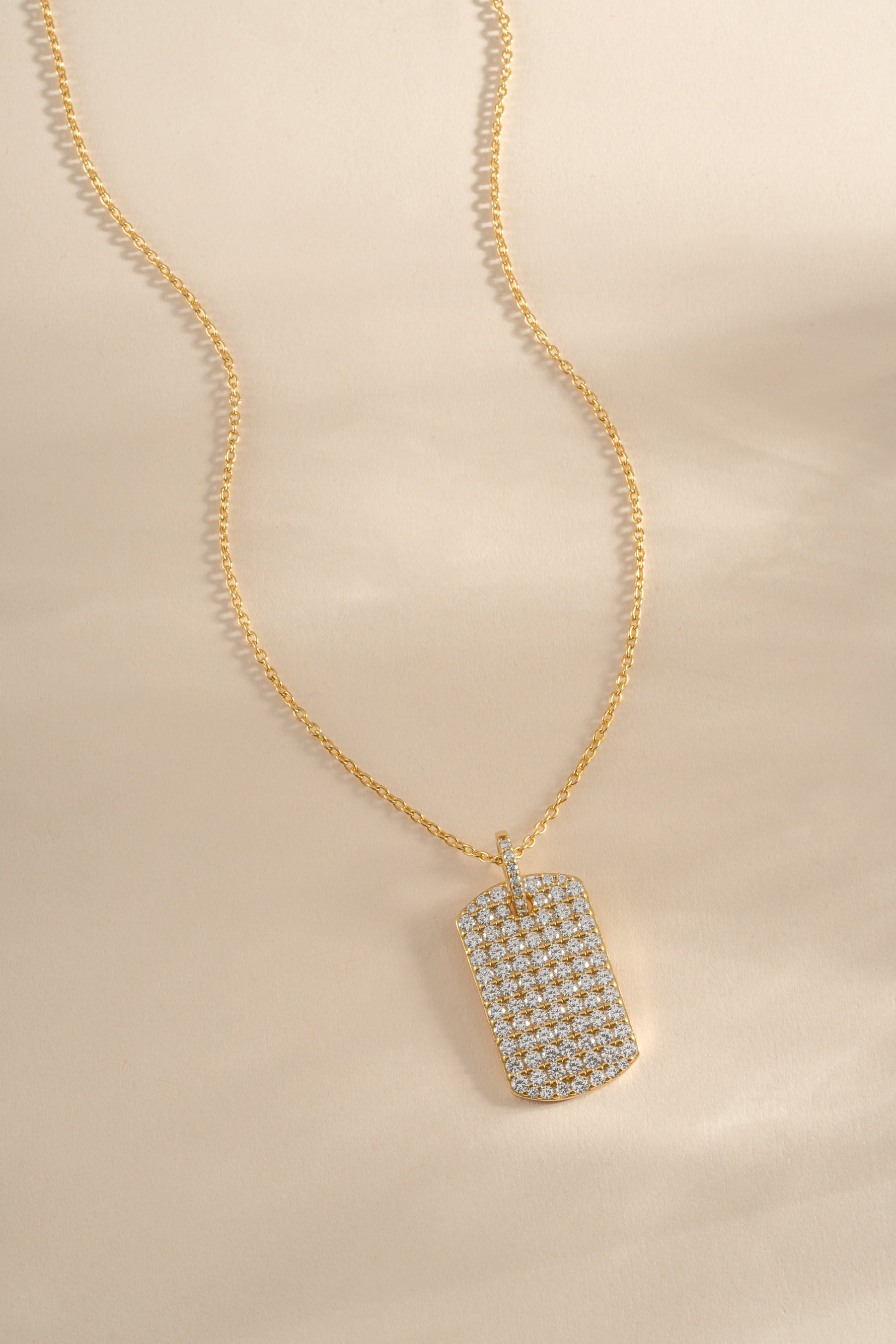 Gold Pavé Dog Tag Necklace by Sami Jewels, front view showing detailed pave design and sleek chain.