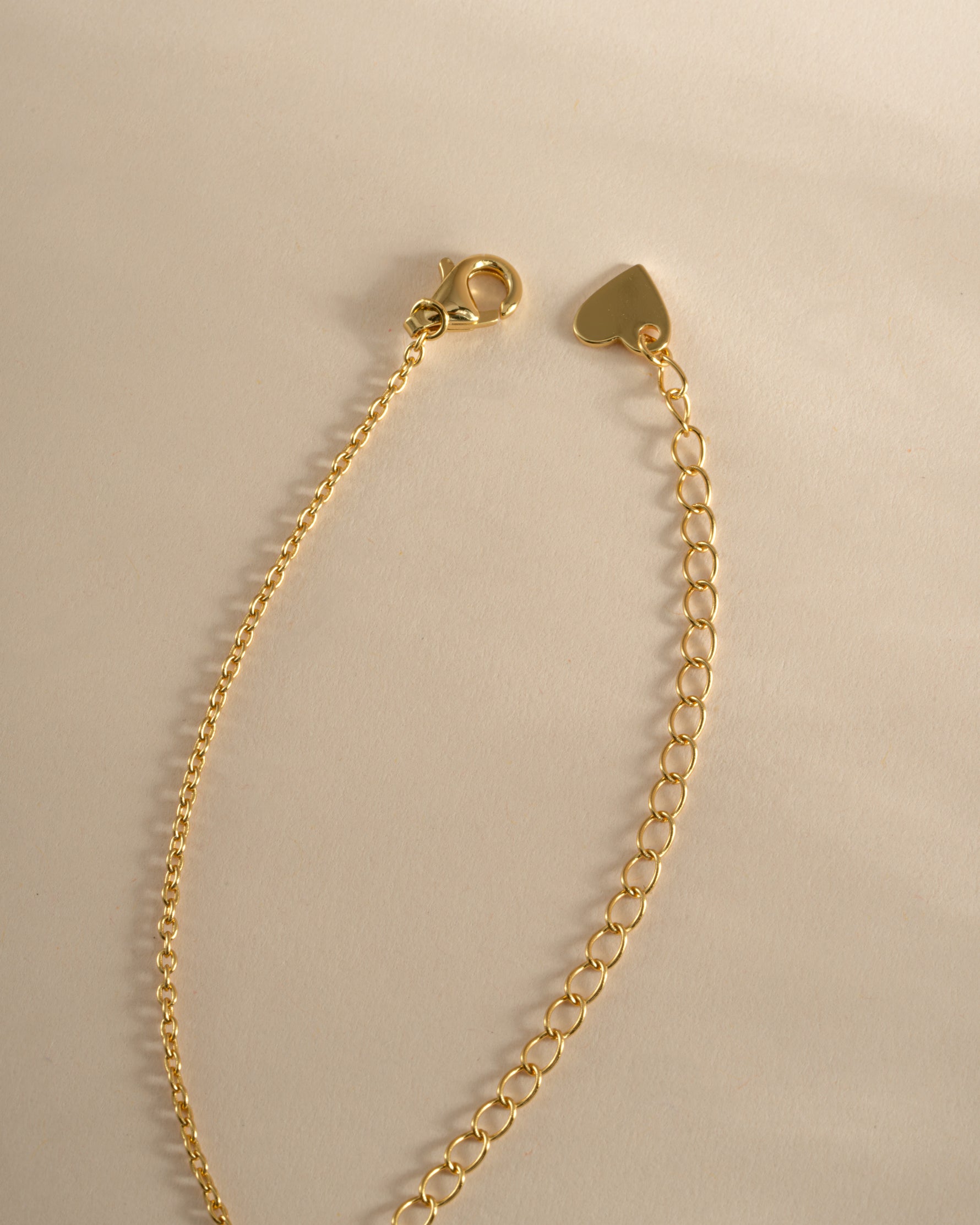 Gold Pavé Dog Tag Necklace by Sami Jewels with lobster clasp closure, featuring sparkling pave details on a stylish chain.