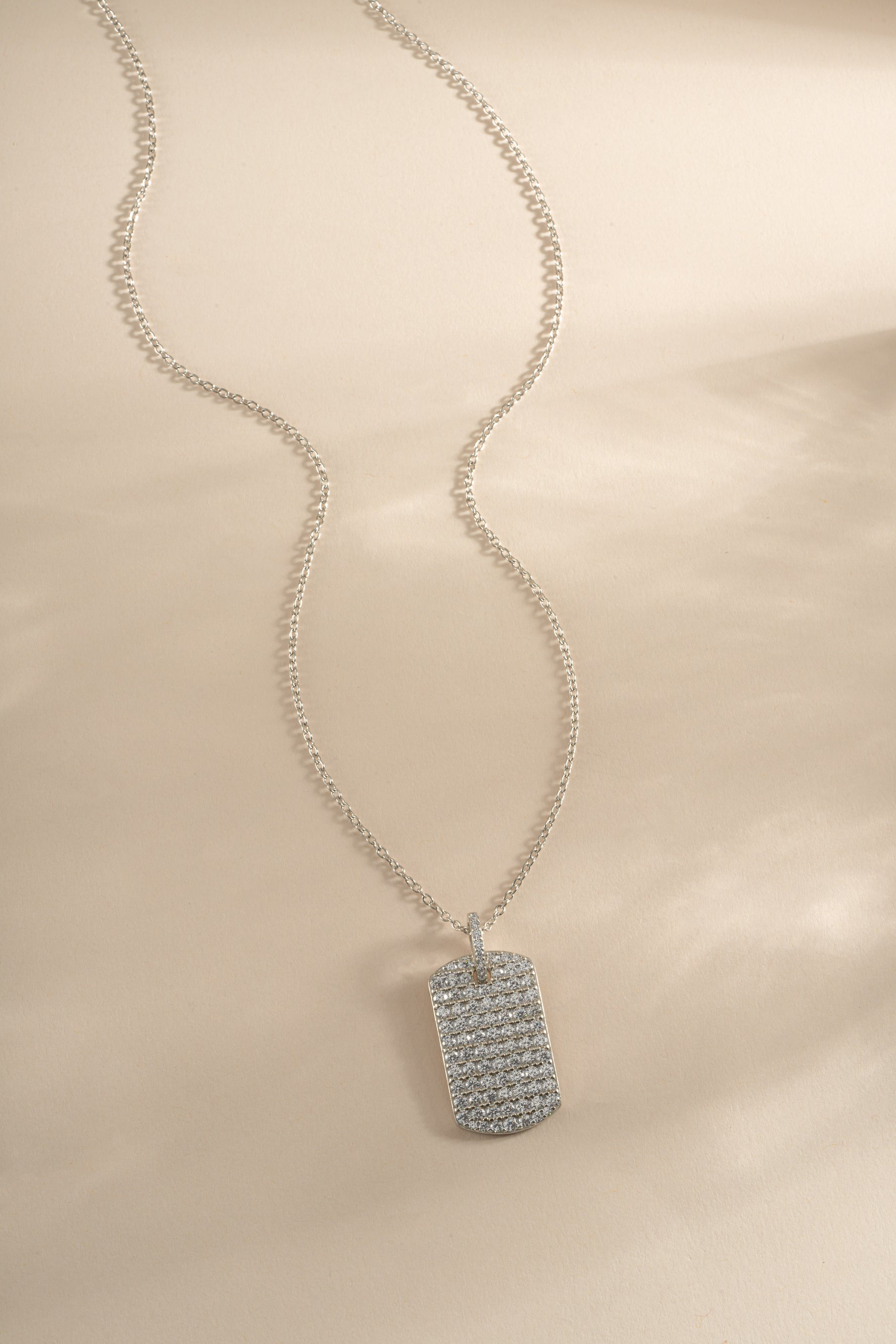 Sterling silver Pavé Dog Tag Necklace by Sami Jewels featuring a sleek, polished dog tag pendant with sparkling pave detailing.