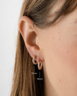 Rose gold 12mm pavé hoop earrings by Sami Jewels, featuring sparkling small and large hoop designs for elegant style.