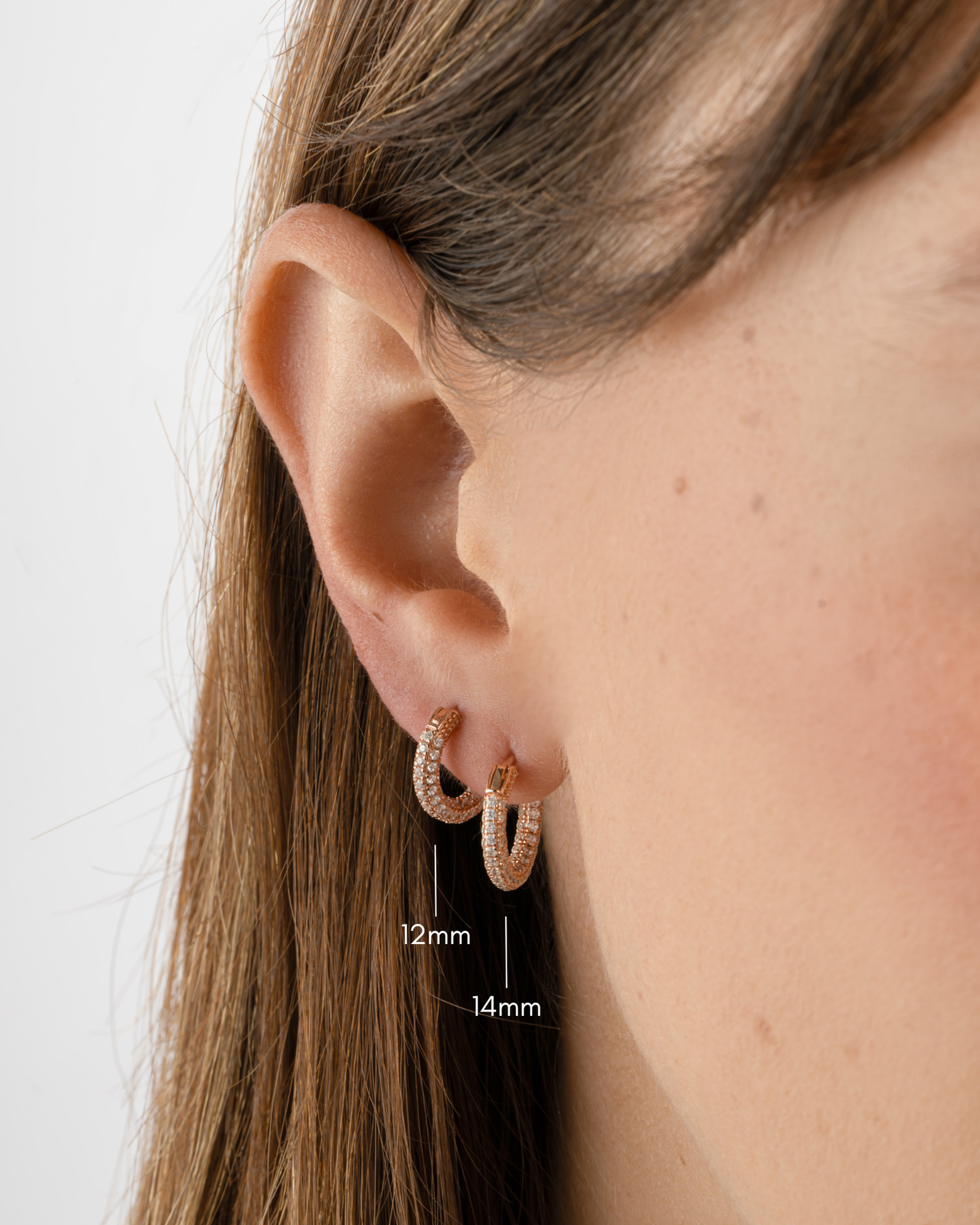 Rose gold 12mm pavé hoop earrings by Sami Jewels, featuring sparkling small and large hoop designs for elegant style.