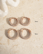 Rose gold 12mm pavé hoop earrings by Sami Jewels, featuring multiple sizes with sparkling gemstone accents.