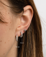 Sterling silver 12mm pavé hoop earrings by Sami Jewels with different sizes and sparkling gemstone accents.