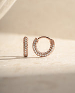 Rose gold 12mm pavé hoop earrings by Sami Jewels featuring sparkling embedded stones and classic hoop design