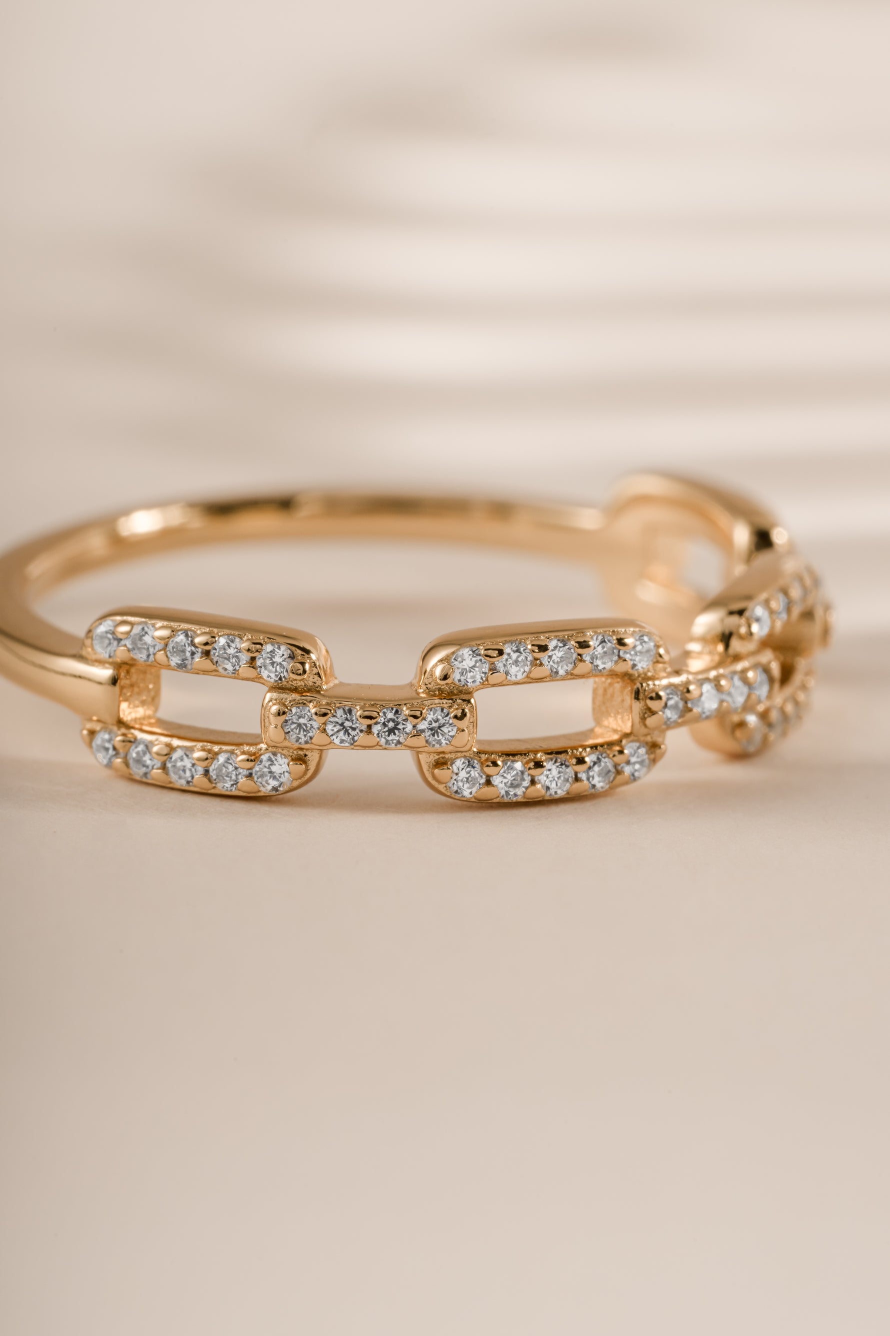 Close-up of Sami Jewels Pavé Link Ring with diamond accents in gold, showcasing intricate design and sparkling details.