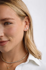 Sterling silver Halo Marquise Stud Earrings with pave detailing by Sami Jewels, shown on a model.