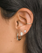Sterling silver Halo Marquise Stud Earrings by Sami Jewels modeled on a person, showcasing elegant pave design.