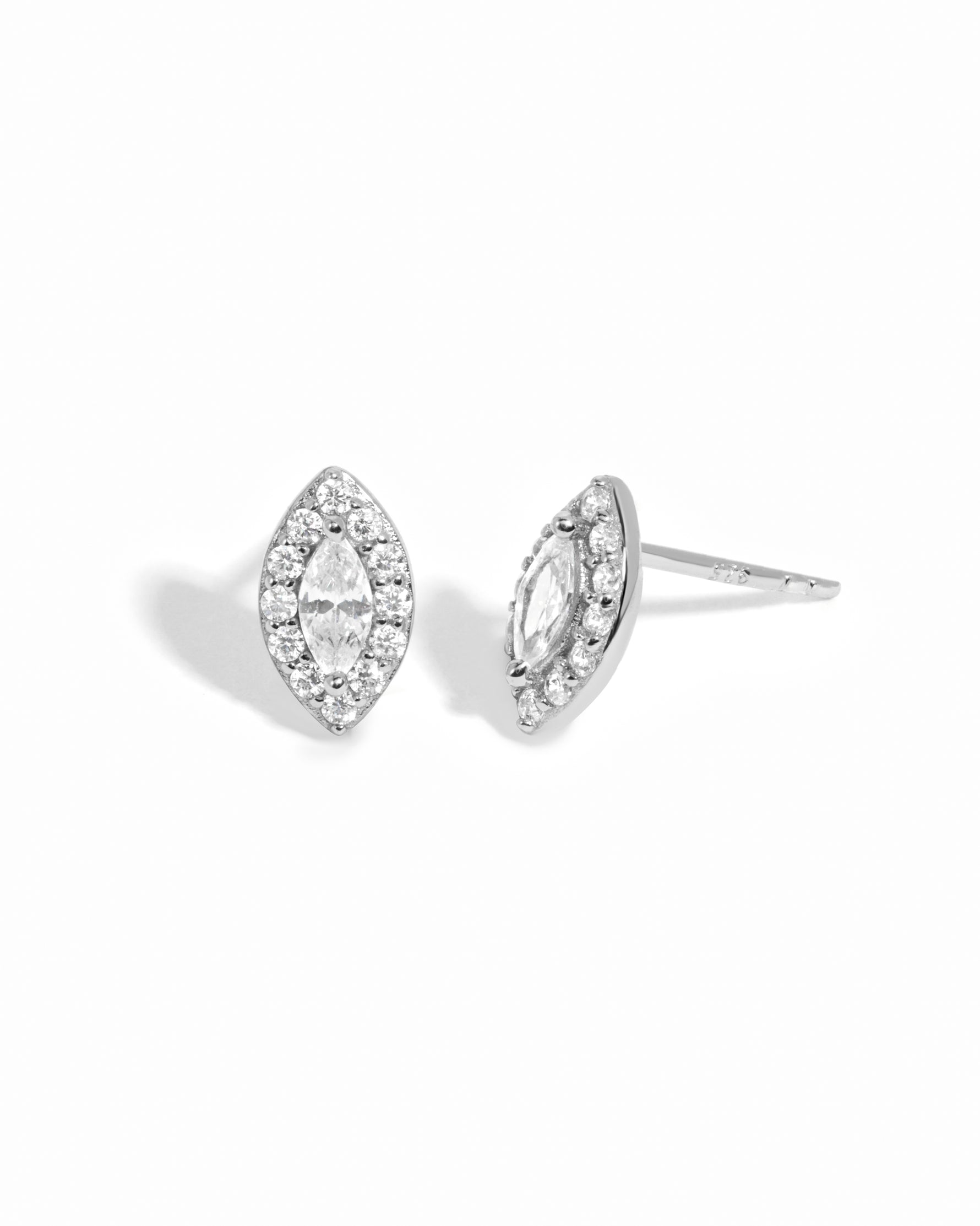 Sterling silver Halo Marquise Stud Earrings by Sami Jewels with pave detailing on a white background.