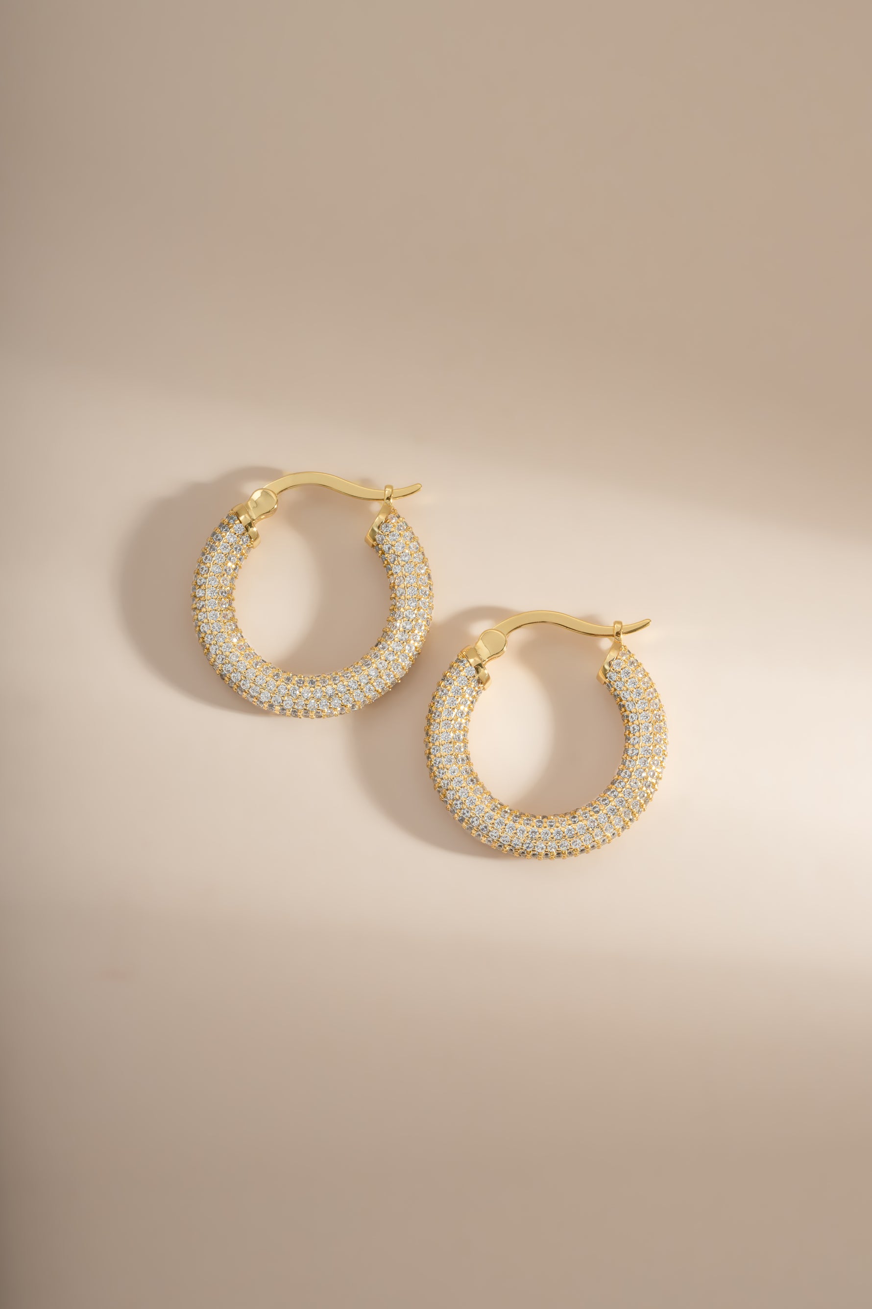 Gold Pavé Tube Hoop Earrings by Sami Jewels featuring sparkling pave detailing and a sleek, modern hoop design