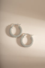 Sterling silver Pavé Tube Hoop Earrings by Sami Jewels featuring sparkling pave detailing and a sleek hoop design.