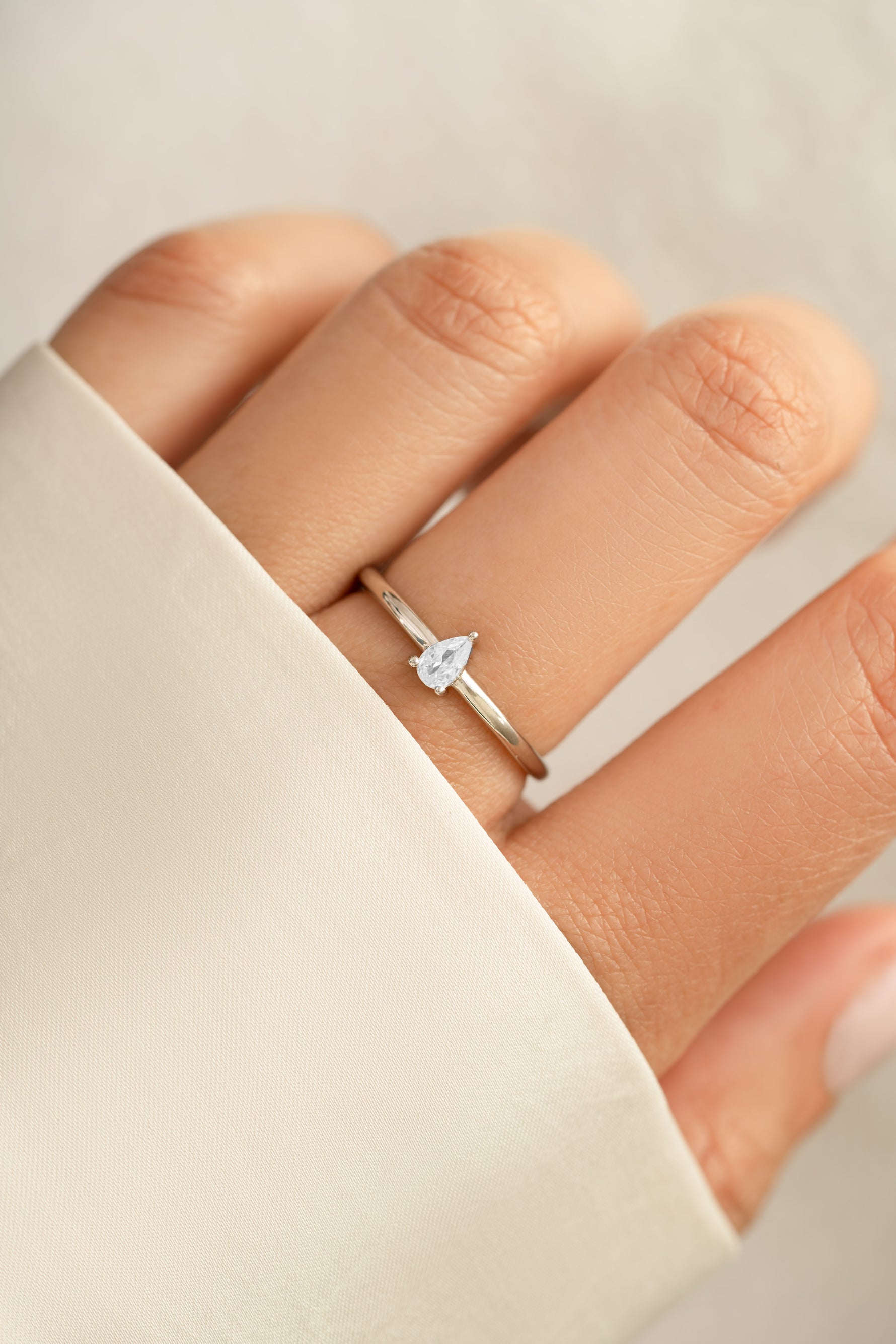 Pear-shaped sterling silver ring from Sami Jewels featuring a sleek, elegant design perfect for stylish jewelry collection.