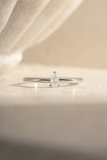 Sterling silver pear-shaped ring by Sami Jewels featuring a smooth, polished design for elegant wear.