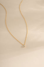 Gold tear drop pendant necklace with pear-shaped diamond by Sami Jewels, featuring an elegant and delicate design.