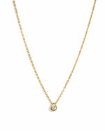 Sami Jewels tear drop pendant necklace featuring a pear-shaped diamond on a gold chain against a white background.