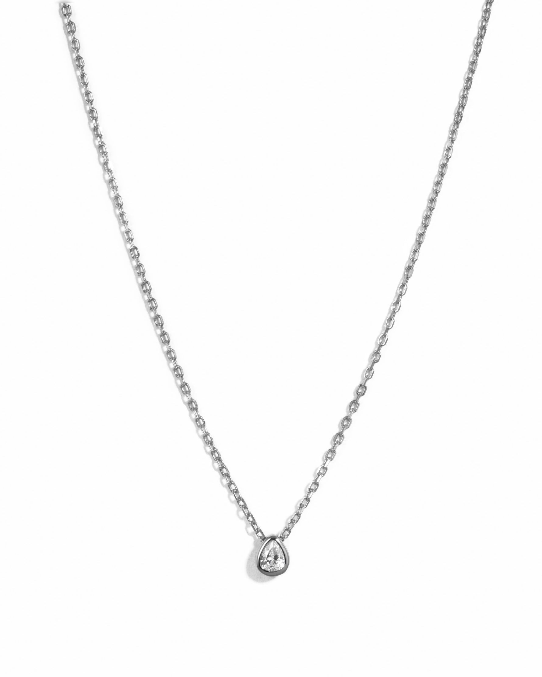 Sterling silver tear drop pendant necklace featuring a pear-shaped diamond from Sami Jewels on a white background.