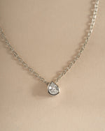 Sterling silver tear drop pendant necklace by Sami Jewels featuring a pear-shaped diamond design.