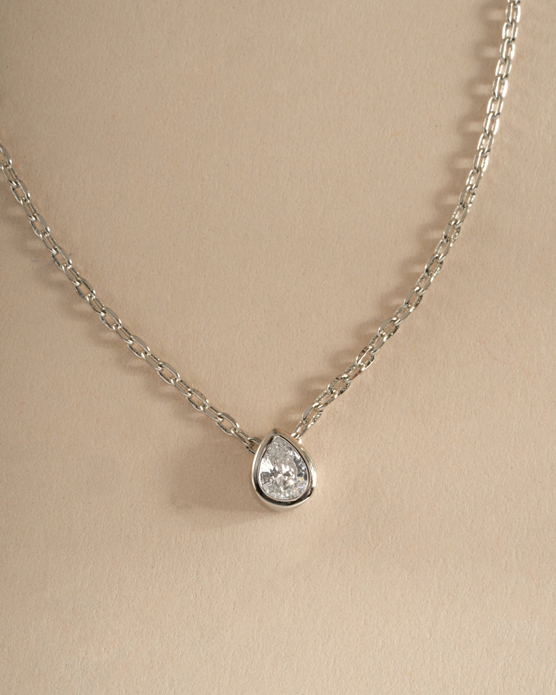 Sterling silver tear drop pendant necklace by Sami Jewels featuring a pear-shaped diamond design.