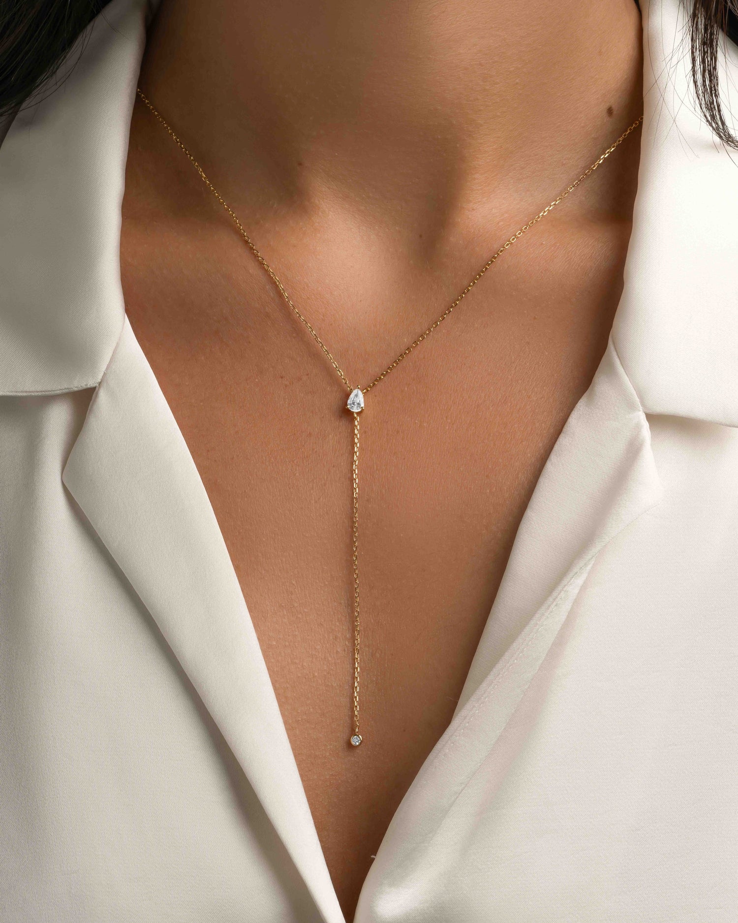 Gold Pear Lariat necklace by Sami Jewels featuring a elegant pear-shaped pendant on a delicate chain.