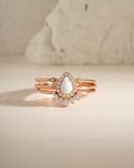 Sami Jewels pear opal ring set with rose gold bands, featuring multiple delicate rings with pear-shaped opal stones.