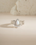 Sterling silver Pear Opal Ring Set by Sami Jewels featuring multiple elegant rings with pear-shaped opals.