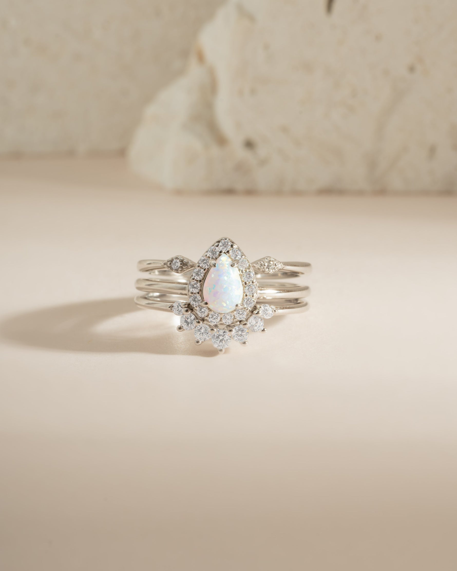 Sterling silver Pear Opal Ring Set by Sami Jewels featuring multiple elegant rings with pear-shaped opals.
