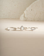 Sterling silver Pear Opal Ring Set from Sami Jewels featuring multiple elegant rings with pear-shaped opal stones.