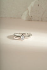Close-up of Sami Jewels Pear Statement Ring featuring a sterling silver pear-shaped design on a sleek band.