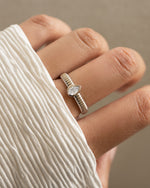 Sterling silver Pear Statement Ring by Sami Jewels featuring a large pear-shaped design on a model's finger.