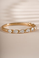 Close-up of Sami Jewels Pear Stone Stacking Ring in gold, showcasing the pear-shaped gemstone and delicate band design.