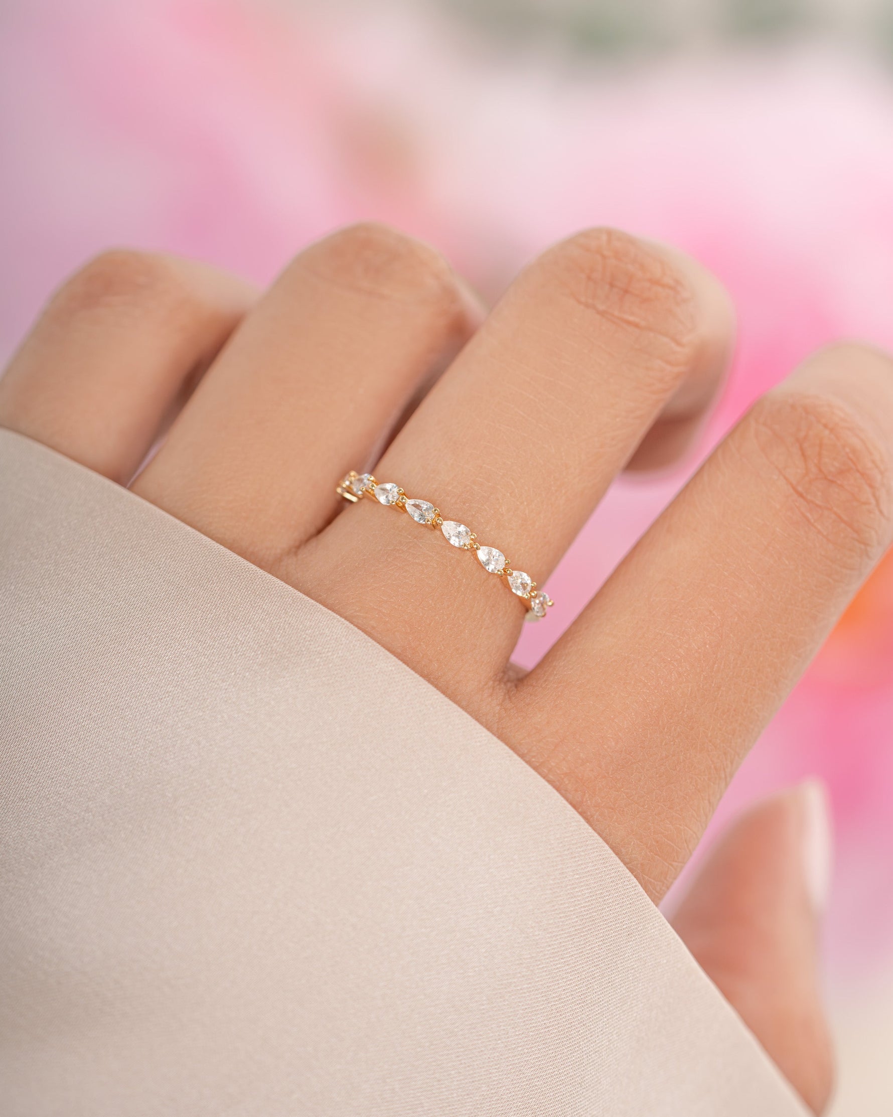 Gold Pear Stone Stacking Ring by Sami Jewels featuring a pear-shaped gemstone and a sleek band design.