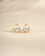 Gold Tiny Pear Stud Earrings from Sami Jewels, front view showing small, elegant pear-shaped design in a close-up image.