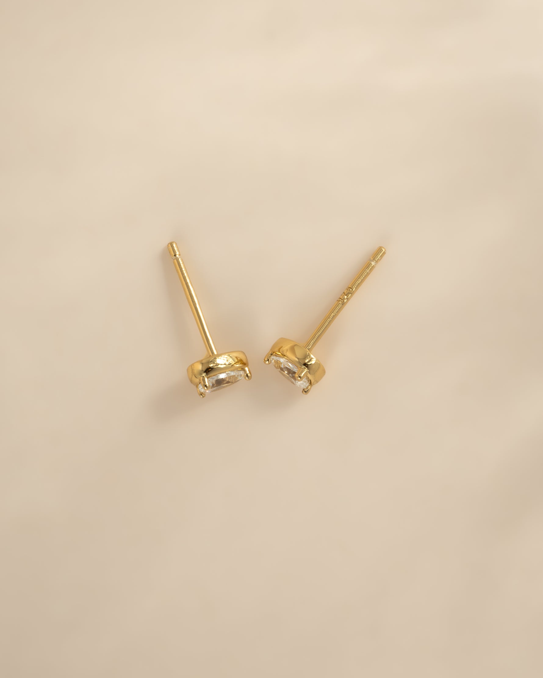 Gold Tiny Pear Stud Earrings from Sami Jewels, top view showing small, elegant pear-shaped design in shiny gold finish.