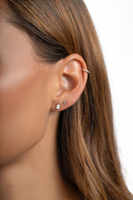 Sterling silver Tiny Pear Stud Earrings by Sami Jewels featuring small, elegant pear-shaped design for everyday wear.