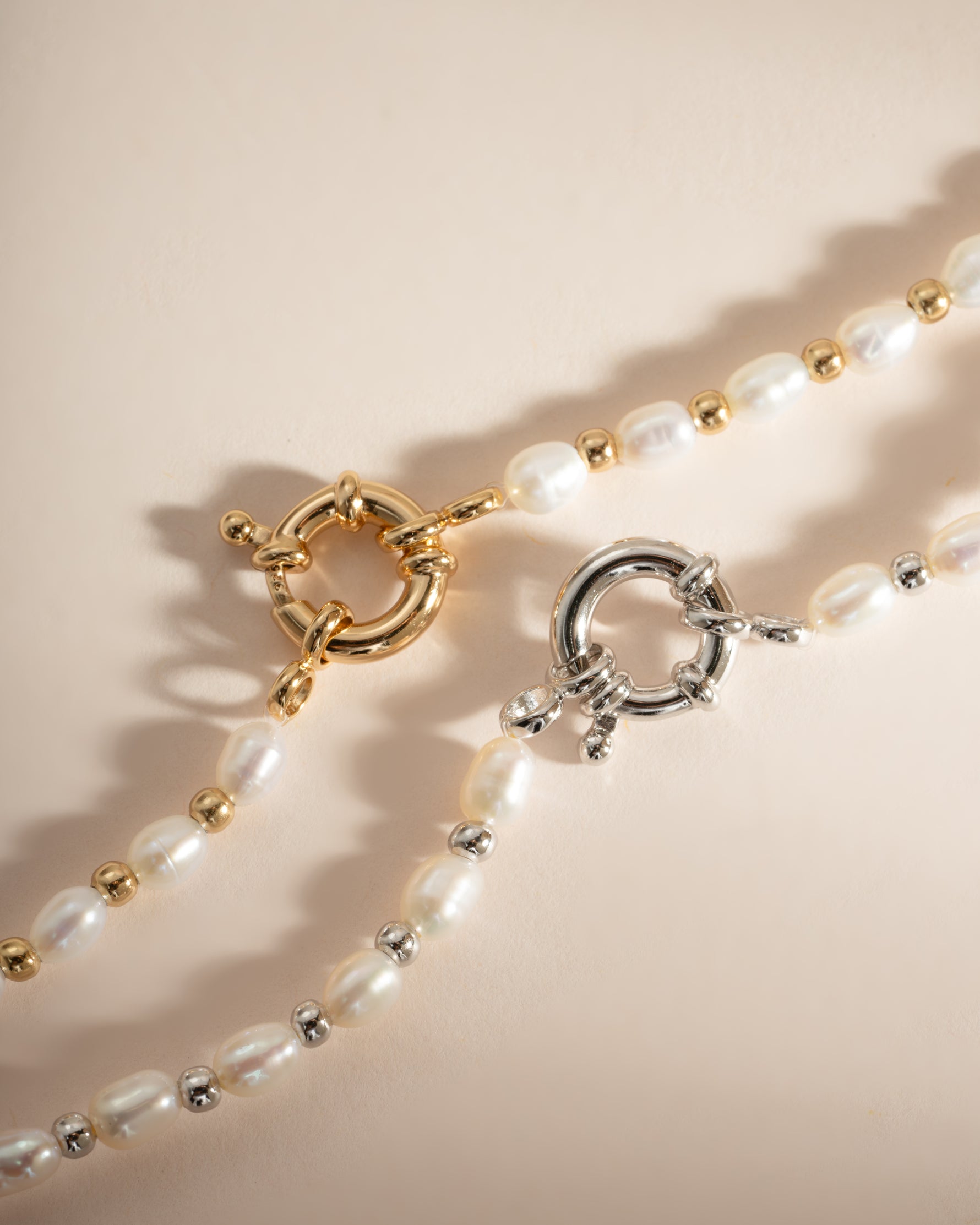 Sami Jewels pearl beaded bracelet with gold and sterling silver accents, showcasing elegant round pearls and delicate craftsmanship.