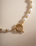 Close-up of Sami Jewels pearl beaded bracelet with gold accents, showcasing elegant jewelry design and fine craftsmanship.